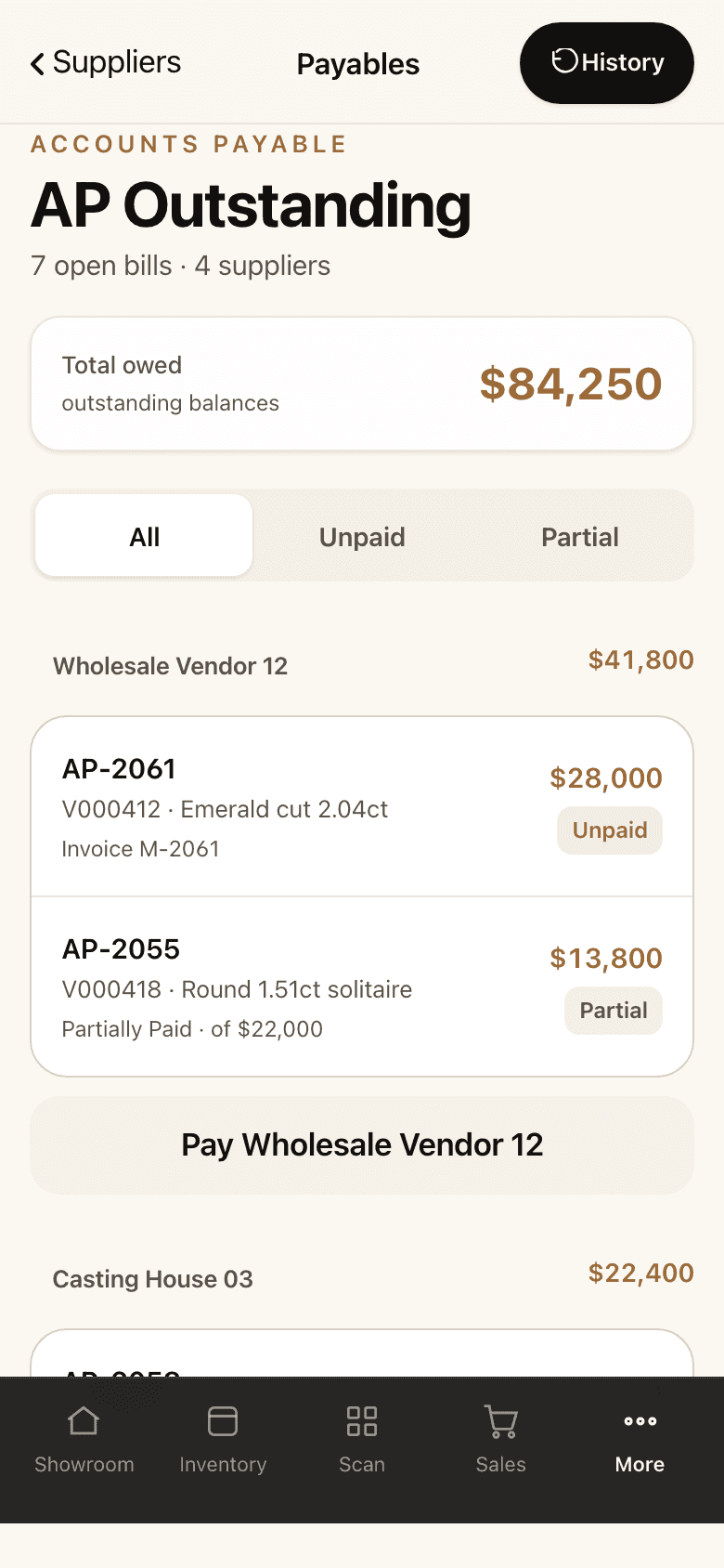 The payables screen on a phone: the total owed, open bills grouped by supplier, and a pay button for each.